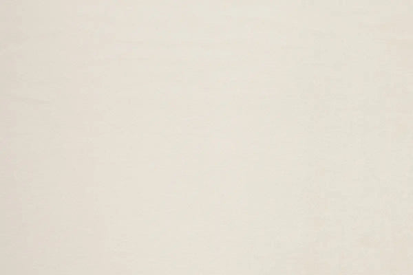 A Ivory table linen with a luxurious texture that offers timeless elegance.