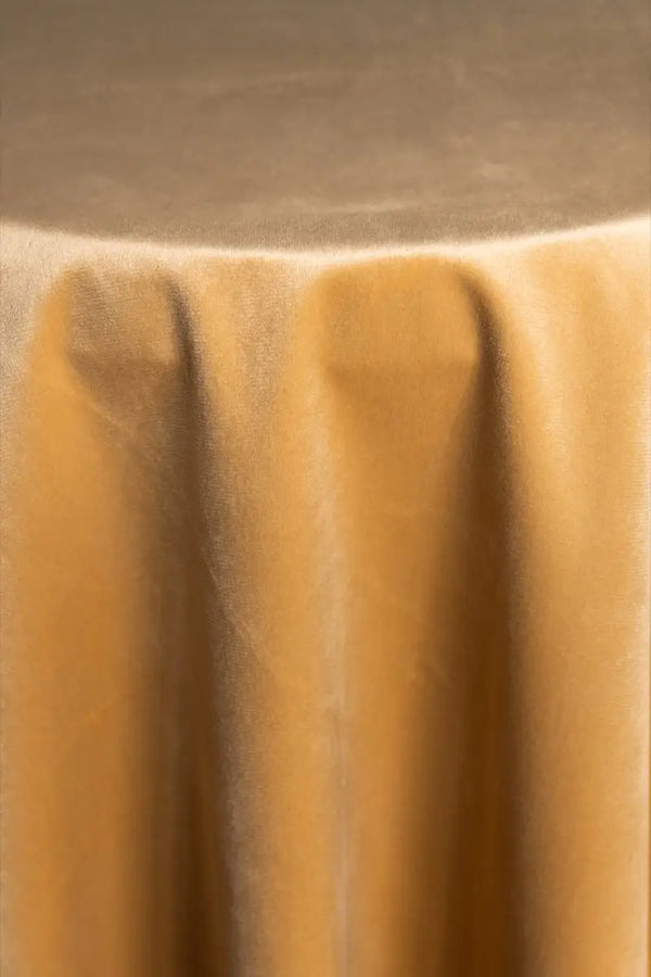 A Peach table linen with a luxurious texture that offers timeless elegance.