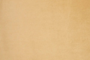 A Peach table linen with a luxurious texture that offers timeless elegance.