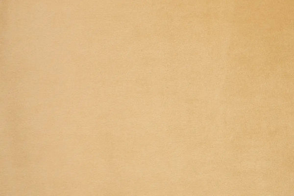 A Peach table linen with a luxurious texture that offers timeless elegance.