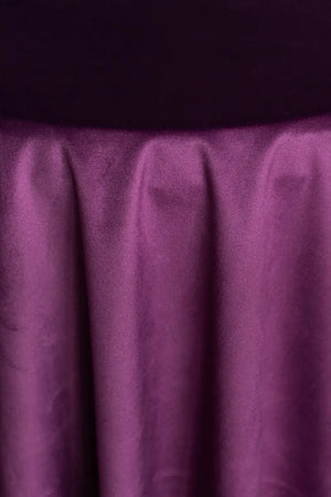 A Purple table linen with a luxurious texture that offers timeless elegance.