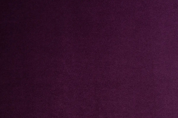 A Purple table linen with a luxurious texture that offers timeless elegance.