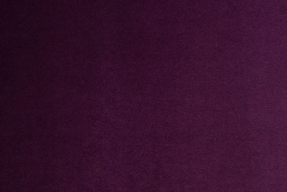 A Purple table linen with a luxurious texture that offers timeless elegance.