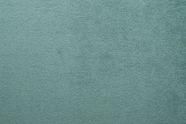 A Soft Green table linen with a luxurious texture that offers timeless elegance.