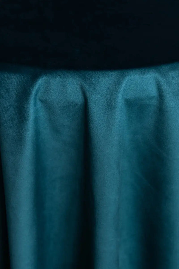 A Teal Green table linen with a luxurious texture that offers timeless elegance.