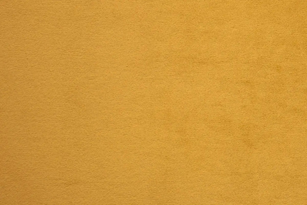 A Yellow table linen with a luxurious texture that offers timeless elegance.