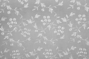 Table linen with lace overlay adding intricate texture and vintage charm to elegant, timeless tables.