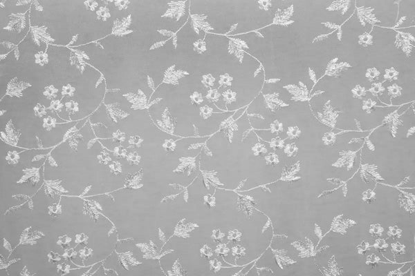 Table linen with lace overlay adding intricate texture and vintage charm to elegant, timeless tables.