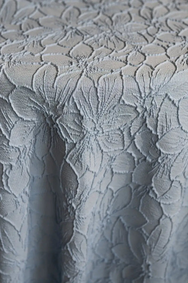 Table linen with intricate florals adding timeless elegance, perfect for graceful and refined table settings.