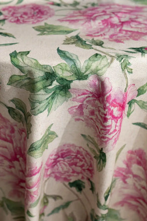 Table linen with soft pink florals infuse romantic charm and timeless beauty into elegant tablescapes.
