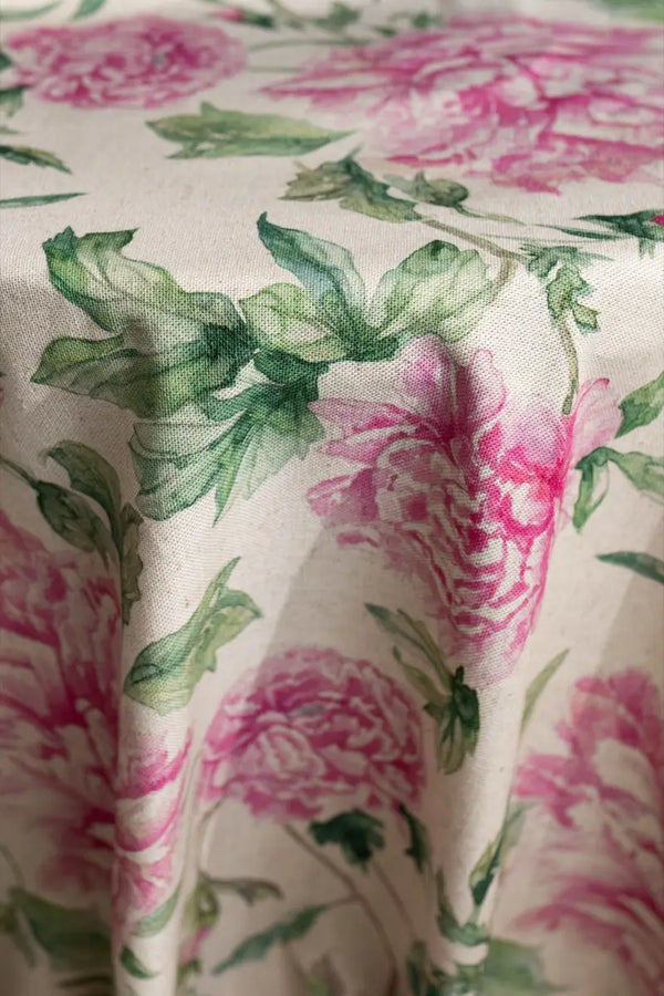 Table linen with soft pink florals infuse romantic charm and timeless beauty into elegant tablescapes.