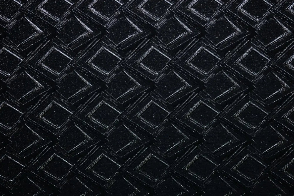 Table linen with bold geometric patterns with a shimmering finish bring modern glamour to sophisticated event tables.