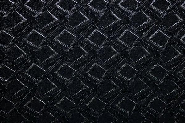 Table linen with bold geometric patterns with a shimmering finish bring modern glamour to sophisticated event tables.