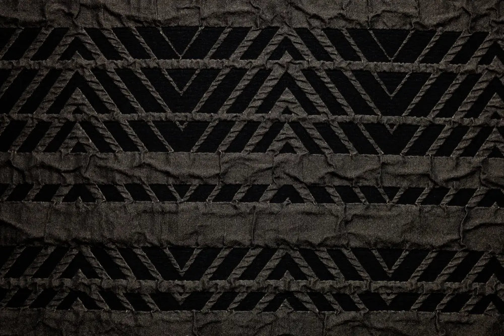 Table linen with striking geometric motifs add contemporary flair and bold elegance to refined table settings.