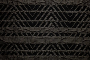 Table linen with striking geometric motifs add contemporary flair and bold elegance to refined table settings.