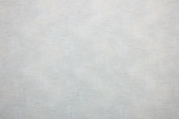 Table linen with natural texture adding warmth and understated elegance to minimalist, modern table settings.