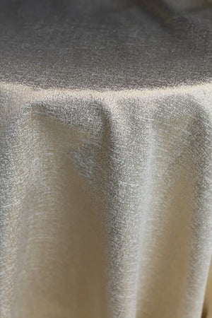 Table linen with golden sheen adds radiant glamour and luminous elegance to luxurious tablescapes.