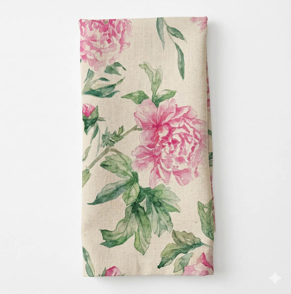 The Esme Linen beige cloth napkin features a watercolor-style floral design with pink florals and green leaves—an elegant choice to add charm to your table linen collection.